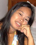 fat lbfm filipina bargirl sits down on a bed