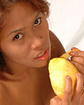 nude asian eating mango